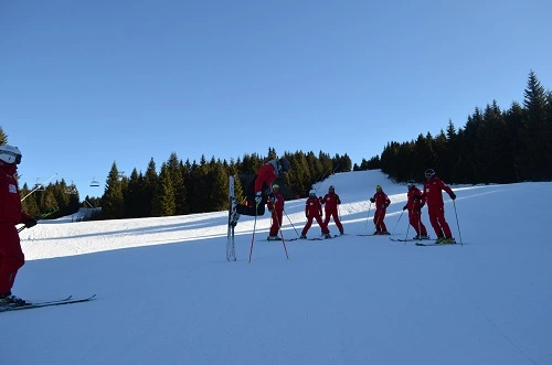 Ski teacher with kids